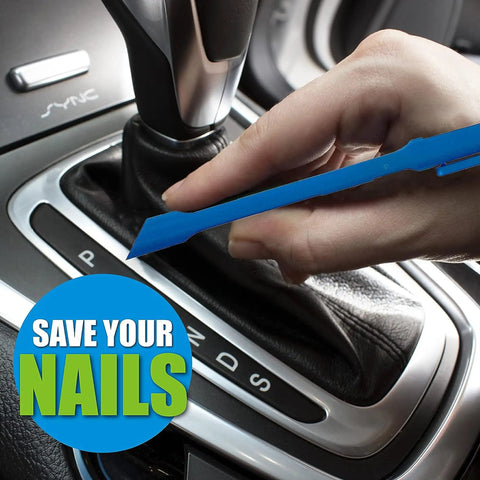 Hand using Plastic Scraper Tool No Scratch Multi Use 5 Pack For Food Labels Stickers Paint And Grease Go To Cleanup Reaches Tight Corners Ergonomic Grip Great For Home Kitchen And Auto Detailing on car gearshift