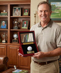 Man holding Golf Ball Display Case For Hole In One Memorabilia, Premium Walnut Wood Box With Engraved Metal Plate, UV Protected Cover