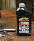 Heavy Duty Platinum Full Synthetic Six Speed Transmission Lube For Harley Transmissions, 1 Quart bottle on workshop table