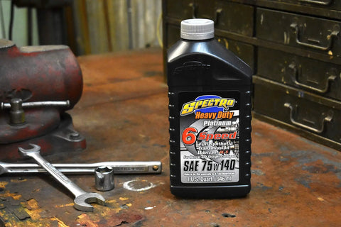 Heavy Duty Platinum Full Synthetic Six Speed Transmission Lube For Harley Transmissions, 1 Quart bottle on workshop table