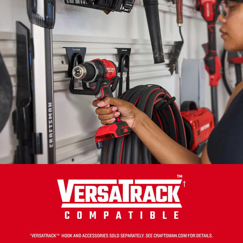 Person placing Compact Brushless Drill Driver With LED Light, 6.2 In Head For Tight Spaces on VersaTrack system in garage.