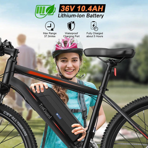 26 Inch Electric Mountain Bike With 350W Motor, woman holding E-bike with 374.4Wh removable battery in park setting