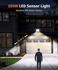 100W Led Floodlights with Motion Sensor, 6000K-6500K Daylight White 80 illuminating a driveway area.