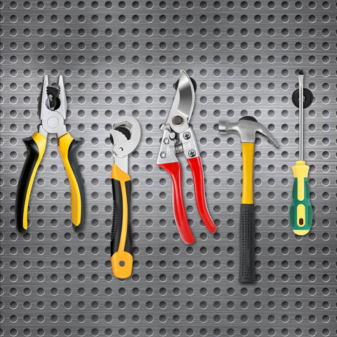Assorted hand tools including pliers, wrenches, shears, hammer, and screwdriver on perforated metal background.