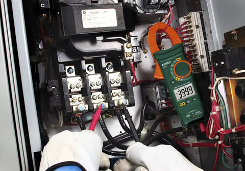 Technician using 400A True RMS AC Clamp Meter with Non Contact Voltage Detection, 1.2 Inch Jaw on electrical panel