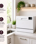 Compact Countertop Dishwasher Featuring A Slick Digital Interface And Six Heavy Duty Wash Cycles Engineered For Top Tier Energy Savings With Quick Connect Faucet Adapter And Flexible Delay Start For A Truly No Sweat Cleaning Routine In Crisp White on kitchen countertop.