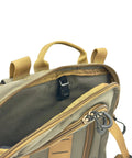 Close-up of Versatile Tactical Hydration Pack With MOLLE System And Three Wear Modes showing handle and zippers