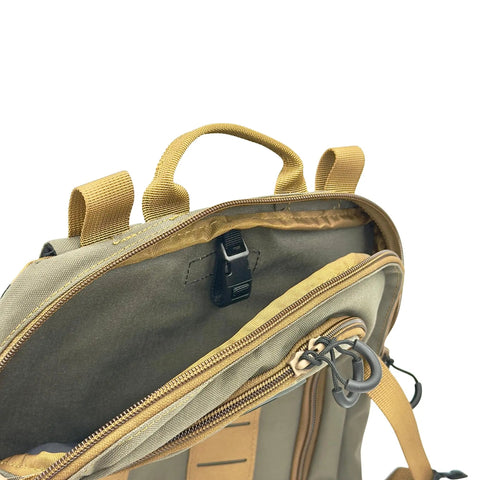 Close-up of Versatile Tactical Hydration Pack With MOLLE System And Three Wear Modes showing handle and zippers