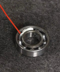 Applying Teflon White Lithium Grease Aerosol Spray 10 Oz For All Weather Lubrication on a metal bearing