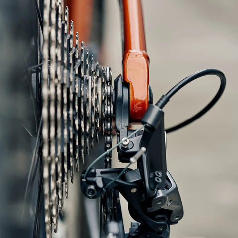 Close-up of Universal Derailleur Hanger for SRAM UDH Standard Beefed Up 6061 Alloy Body With Fiber Reinforced Thermoplastic Black Finish