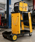 Heavy Duty Multi-Function Welder Trolley For Mig Tig Arc Plasma Cutter With Four Drawer Chest And Safety Chains Moves Effortlessly Across Workshop Floors No Sweat with a welder secured on top.