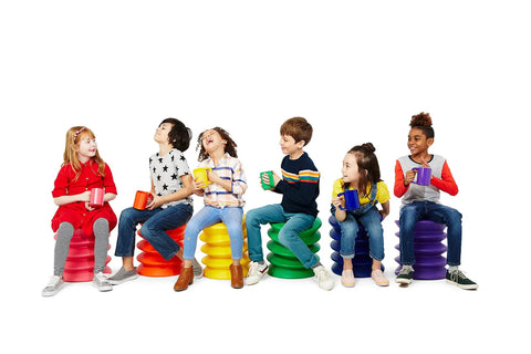 Kids sitting on colorful Active Sitting Stools for Kids Ergonomic Wiggle Friendly Desk Chair Designed to Boost Focus and Concentration