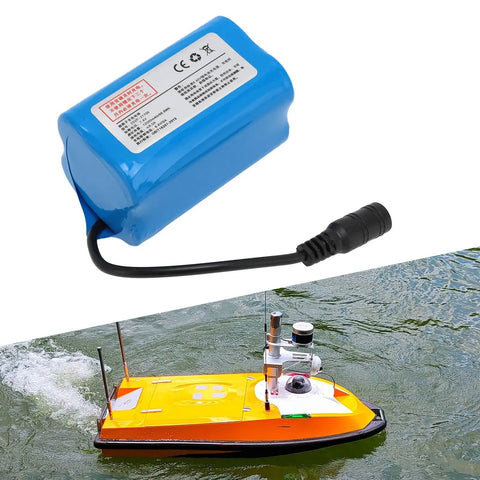 Massive 12000mAh 7.4 Volt Rechargeable Lithium Battery For RC Fishing Bait Boats beside yellow boat on water
