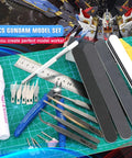 53 Piece Hobby Model Tools Kit for Cutting Sanding Carving and Assembly with ruler, blades, and sanding sticks on green mat.