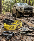 Off-road scene with a Toyota behind a Beefy 10 Ton Winch Snatch Block Pulley Heavy Duty 22,000 Pound Capacity for Off Road Recovery