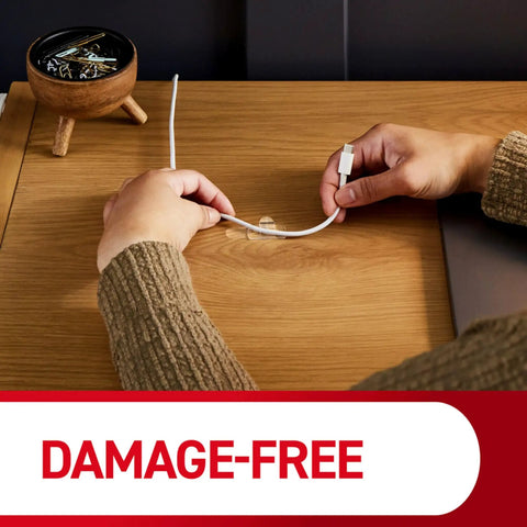 Using Round Cord Clips For No Tool Cable Management Clear Damage Free Hanging Wall Clips on a wooden desk for cable organization.