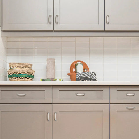 Modern kitchen setup with light cabinets and tile backsplash, featuring Solid 3 Inch Square Arch Cabinet Pulls In Matte Black 25 Pack Big Drawer Handles.
