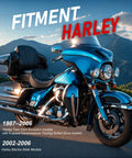 Harley-Davidson touring motorcycle, blue with chrome accents, front-side view on mountain road.