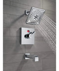 Ara Tub Spout Chrome With Pull Up Diverter, 5.5 Inch Reach, shown installed in modern bathroom, chrome finish, water flowing from shower