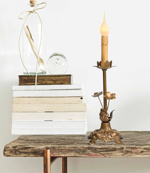 Silicone Dipped Candle Bulbs For Candle Lamps And Window Candles, 7 Watt Cozy Glow on decorative stand with books in the background