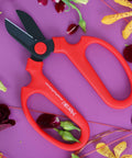 Floral Scissors Set Of 3 With Carbon Steel Blades For Precise Flower Pruning And Arranging on purple surface with flowers.