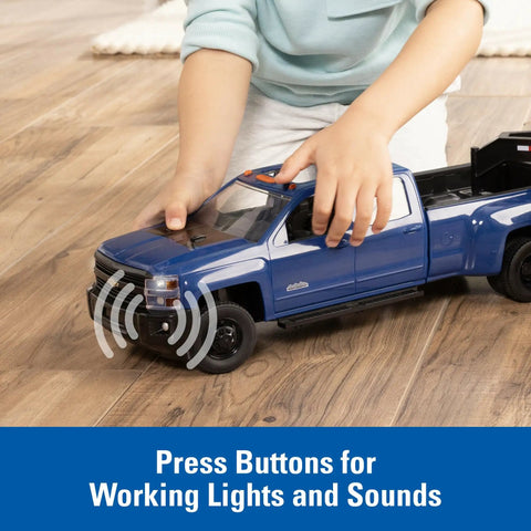 Child playing with Chevy Pickup Truck Toy With Lights And Trailer For Indoor And Outdoor Play A Real Work Rig Experience 1 To 16 Scale