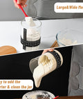 Person using Complete Sourdough Starter Jar Kit 35 Oz Large Glass Jar With Date Marked Feeding Band to pour starter
