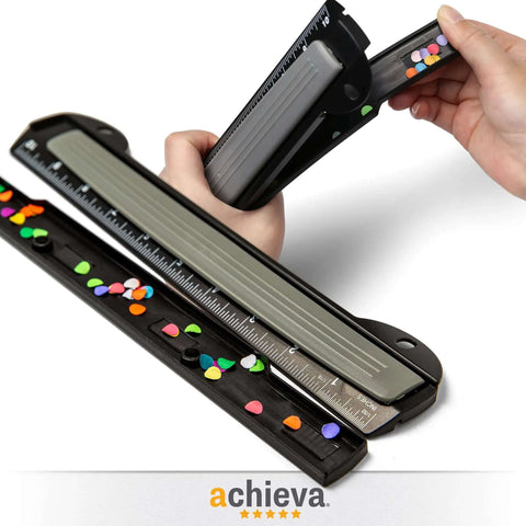 Close-up of On The Go 3 Hole Binder Punch for Ring Binders in black, ultra-compact design with ruler, used for organizing documents efficiently.