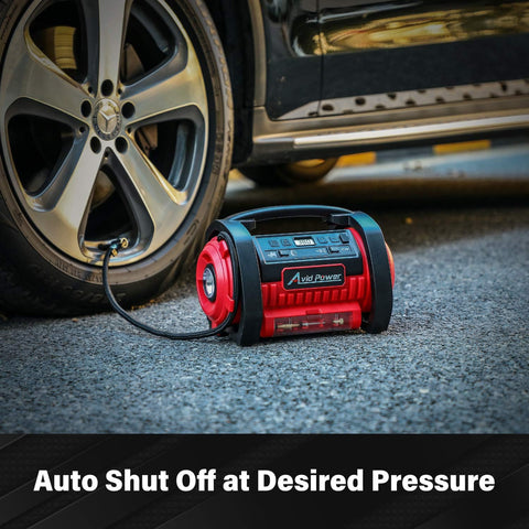 Portable Tire Inflator Air Compressor With Dual Motors, 12V DC And 110V AC, connected to a car tire on pavement