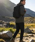 Man hiking with Lightweight Insulated Hydration Backpack With 2L Or 3L Water Bladder For Hiking, Trail Running, Cycling And Race Day