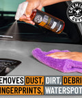 Hand spraying Meticulous Matte Finish Detailer and Sealant for Satin and Matte Surfaces Quick Detailer on car hood with cloth
