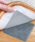 Hand demonstrating installation of Non Slip Rug Gripper Pads For Hardwood Floors, Heavy Duty No Slip Carpet Tape, grey pad visible