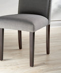 Top Shelf Felt Furniture Protectors For Hardwood Floors Beige Self Stick Pads under grey chair leg on light wood floor.