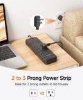 Flat Plug Power Strip With Surge Protector 1700J Converts 2 Prong To 3 Prong Outlets on desk near laptop and couch