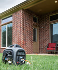 Gas Powered 2300 Watt Quiet Inverter Generator for Home Backup with USB Outlet on lawn near brick house