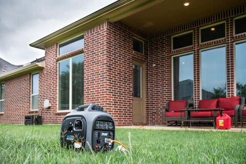 Gas Powered 2300 Watt Quiet Inverter Generator for Home Backup with USB Outlet on lawn near brick house