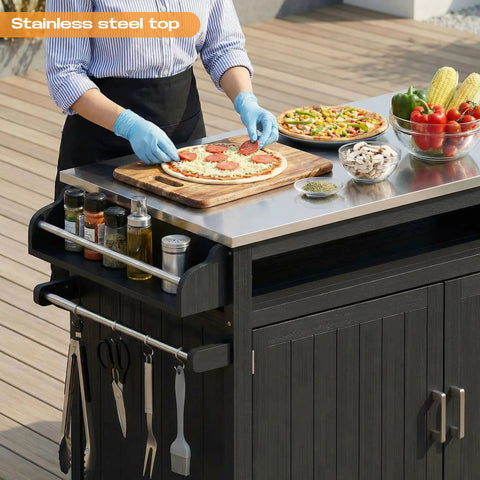 Person preparing food on 43.3-Inch Outdoor Kitchen Island With Storage Cabinet And Stainless Steel Top All-In-One Solid Wood Prep Station.