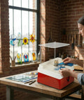 Artist using Diamond Grinder Bits Set One Inch And Five Eighth Inch Two Pack With Brass Core Automatic Water Feeding for stained glass.