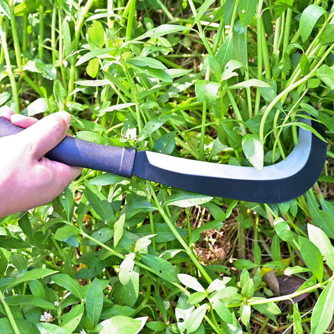 Person using Beast Mode Machete Sickle For Weed Removal And Grass Clearing With Magnetic Long Handle in garden