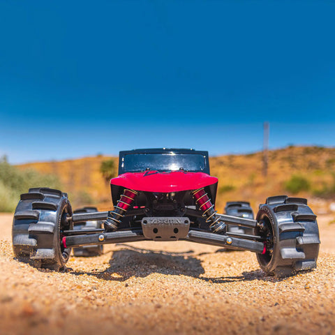 Front view of RC vehicle with Belted 2.8 Inch Sand Paw HP Paddle Tires On Raid Black 6x30 Wheels for sand drag racing.