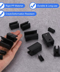 16 Piece Black Office Chair Leg Caps With Nails Smooth Glide Floor Protectors Fitting 0.47 Inch Metal Tubes displayed in hand.