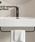 HAOCHRYSYPH Ceramic Wall Mount Sink with Towel Rack, Milk White, 23.63 in. with towel underneath on a smooth wall.