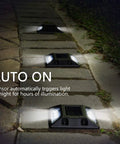 Solar Powered LED Deck Lights 6 Pack For Walkways And Driveways glowing on stone path at night