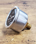 Side view of 60 psi motorcycle oil pressure gauge with chrome housing, black dial face, 1/8 in. NPT brass fitting