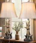 Set Of 2 Rustic Table Lamps For Living Room Farmhouse Antler Resin Nightstand Lamps With USB Charging Ports Three Way Dimmable Cozy Shaded Bedside Lighting LED Bulbs Included shown on a wooden table with a vase.