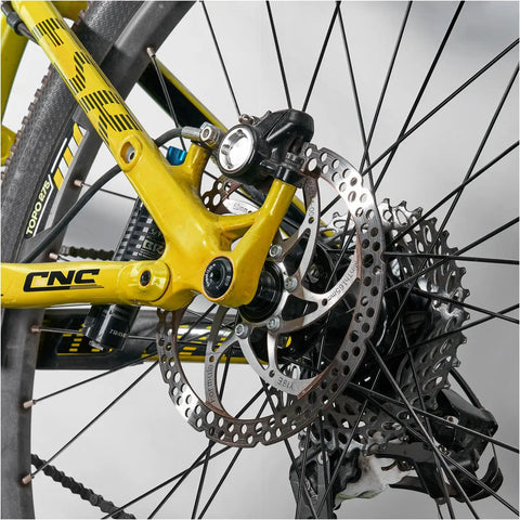 Close-up of rear bike wheel with Beefy 12mm Thru Axle For Front And Rear Bike Hubs Fits 123mm 142mm 162mm 168mm 171mm 175mm 177mm 181mm Lengths With M12x1.5 Thread Pitch Perfect For MTB Gravel Road E Bike And BMX Upgrades, showing CNC-machined axle.