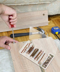 Person using 49 Piece M6 X 40-80mm Hex Socket Cap Screws And Barrel Nut Set For Furniture Repair to assemble wood panels