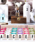 Assorted decorative items with labeled vinyl letters and numbers, similar to Self Adhesive Vinyl Letters And Numbers Kit 8 Sheets Black 1 Inch Characters 536 Pieces For Mailboxes Signs Windows Doors Cars Trucks Home And Business.