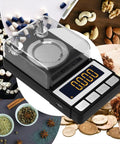 Ultra Precise Milligram Scale 50g 0.001g With 2X 20g Calibration Weights, Reloading Scale For Jewelry And Gold Powder, High Precision MG Scale With Large LCD Display, Battery Included, Great For Tiny Measurements visible with calibration weights, LCD display, and jewelry items around