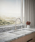 Kaori Single Handle Kitchen Faucet With Pull Down Sprayer And Soap Dispenser In Vibrant Stainless Finish on marble countertop